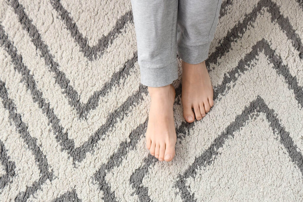 Bare feet on a carpet.