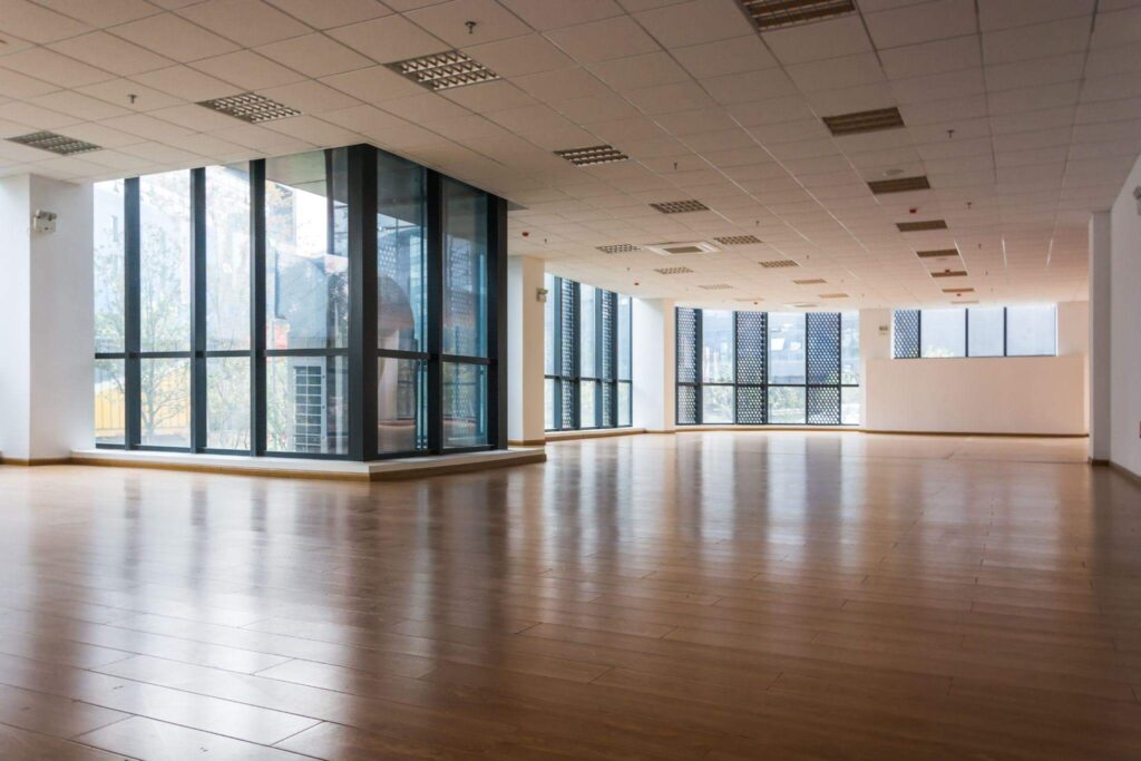 Newly installed flooring in an empty building.