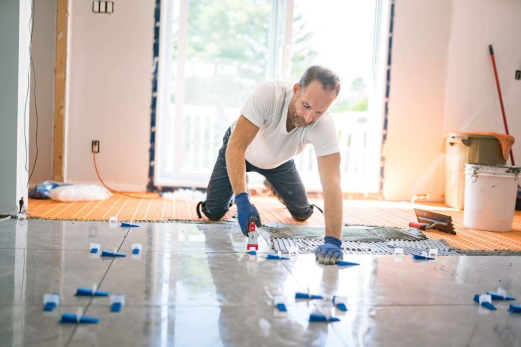 Man working on a residential flooring project.